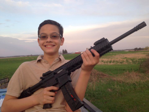 Michigan Republican posts photos of his kids with AR-15 semi-automatic rifles, calls them “modern muskets” & “weapons for liberty”
